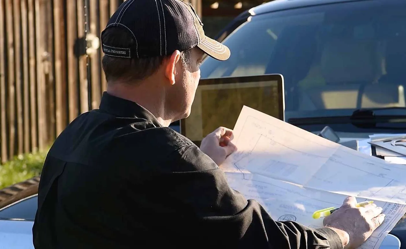 agent looking at plans